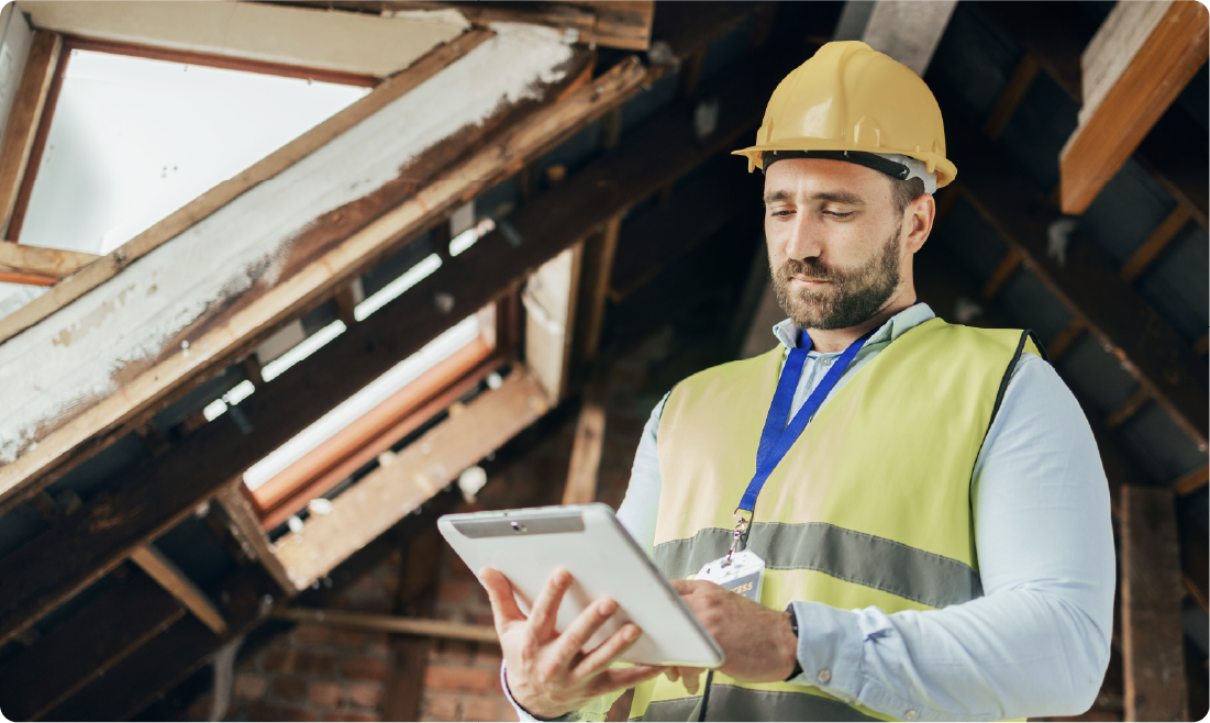 Construction professional inspecting a building